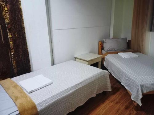 Posteľ alebo postele v izbe v ubytovaní Pas-it Hostel Sagada