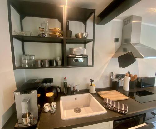 a kitchen with a sink and a counter top at Little Lopsi in Detmold