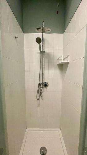 a bathroom with a shower with a toilet in it at Les Petites Maisons in Montevarchi