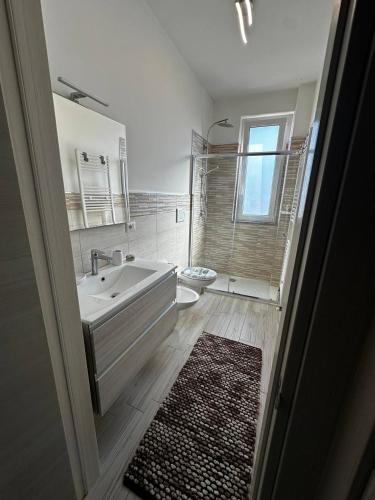 a bathroom with a tub and a sink and a toilet at Bella Puglia Bed and Breakfast in Ruvo di Puglia