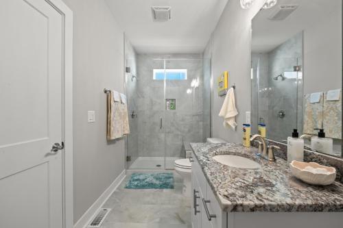 a bathroom with a sink and a toilet and a shower at North Myrtle Beach Home - Walk to the Ocean! in Myrtle Beach