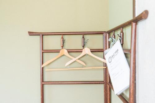 a closet door with a sign on it at Bigtree Guesthouse in Izumi-Sano