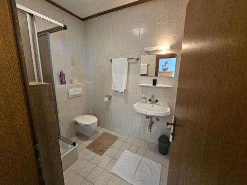 a bathroom with a toilet and a sink at Apartment Aleks in Bach