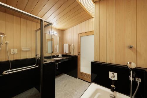 a bathroom with a shower and a sink at Nagoya Marriott Associa Hotel in Nagoya