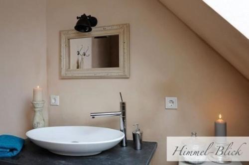 a bathroom with a large white sink and a mirror at Wohnung in Pünderich mit Terrasse in Pünderich