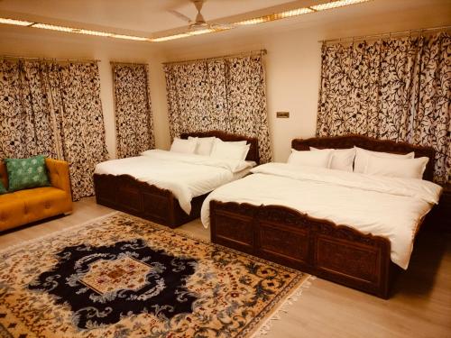 Ένα ή περισσότερα κρεβάτια σε δωμάτιο στο New Zamrood Holiday Home