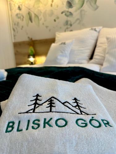 a blanket on top of two beds in a room at Blisko Gór Szyndzielnia in Bielsko-Biala