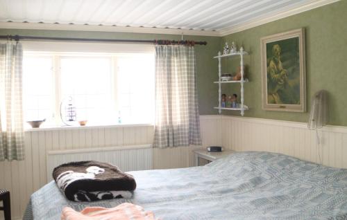 a bedroom with a bed and a window at Beautiful Home In Leksand With Wifi in Leksand
