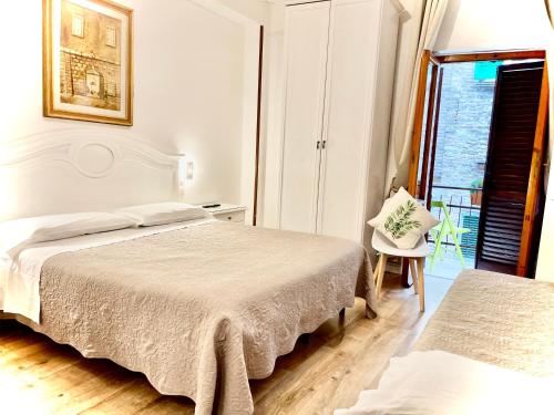 Кровать или кровати в номере Hotel S. Ercolano