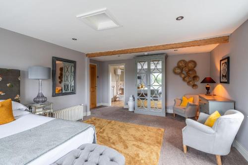 a bedroom with a bed and a living room at Harelands in Aldbrough
