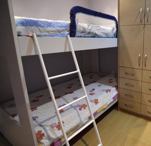 a bunk bed with two bunk beds in a room at Anna's Sea View House in Monemvasia