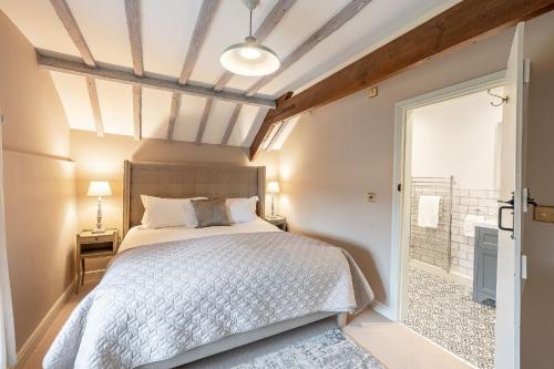 a bedroom with a bed and a window at Sun Hill Cottage in Leyburn