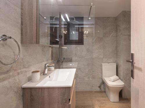 a bathroom with a sink and a toilet at Al Centro Zante city flat in Zakynthos