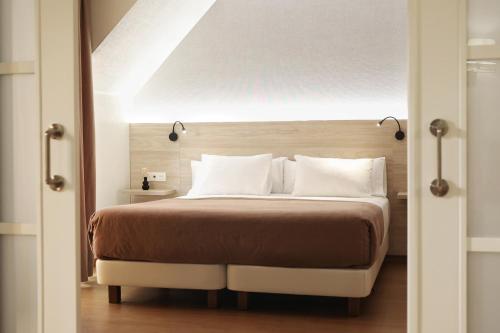 Ένα ή περισσότερα κρεβάτια σε δωμάτιο στο Hotel Maruxia *** Superior