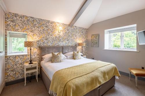 a bedroom with a large bed with a yellow bedspread at Austin in Richmond