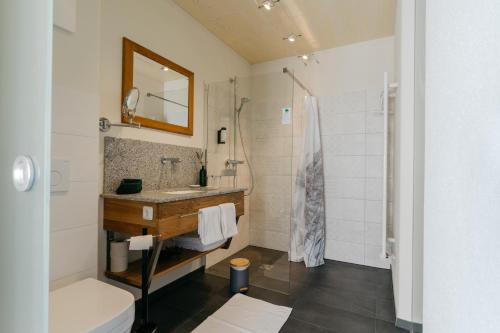 a bathroom with a sink and a shower at Monschein Weingut Straden in Straden