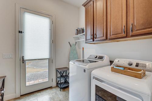 a laundry room with a washing machine and a window at Poolside Relaxation Queen Creek Oasis with Fire Pit in Queen Creek