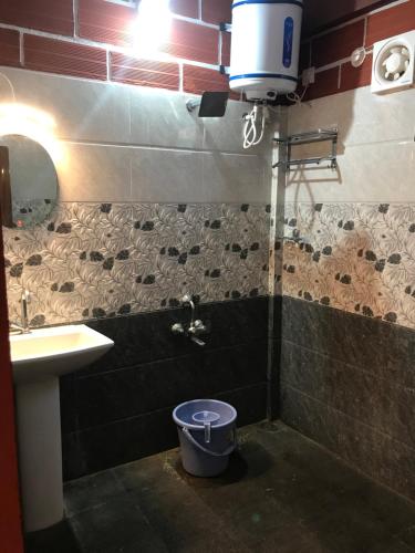 a bathroom with a toilet and a sink at Hotel Chef Knife (Part of Querencia Precinct) in Gonikoppal