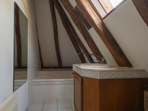 a bathroom with a sink in a attic at Holiday Home Le Moulin by Interhome in Fons