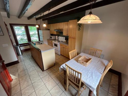 an overhead view of a kitchen and dining room with a table at Cozy 3BR Beach House by the Sea in Old Orchard Beach