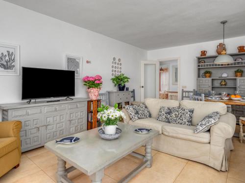 a living room with a couch and a tv at Apartment Dona Lola by Interhome in Sitio de Calahonda