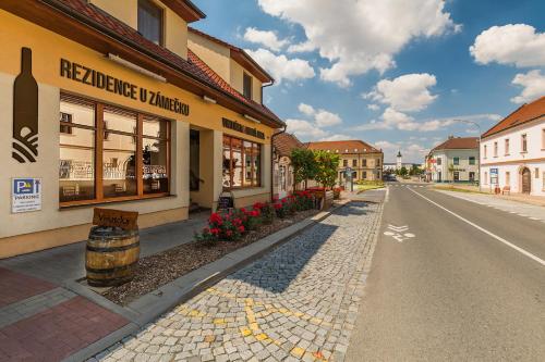 an empty street in a town with a building at Apartmány KiRi in Kyjov