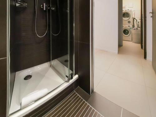a bathroom with a shower and a toilet at Apartment Les Terrasses C1-7 by Interhome in Montreux