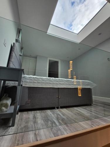 a living room with a skylight in the ceiling at Livestay Luxury Studio in N22 London in London