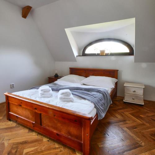 a bedroom with a bed with two towels on it at Penzion Pivovar Volt in Jablonec nad Nisou