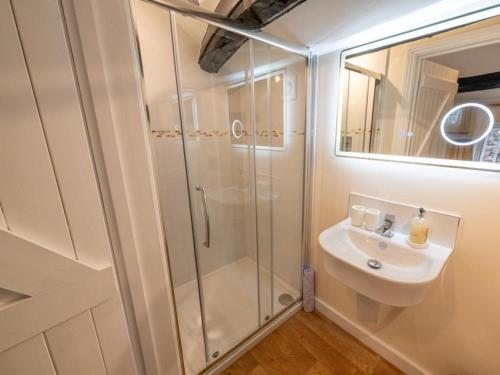 a bathroom with a shower and a sink at 3 Bed in Buttermere 82775 in Buttermere