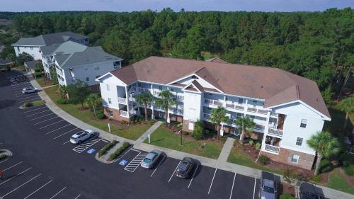 an aerial view of a hotel with a parking lot at Arbor Trace #811 condo in North Myrtle Beach