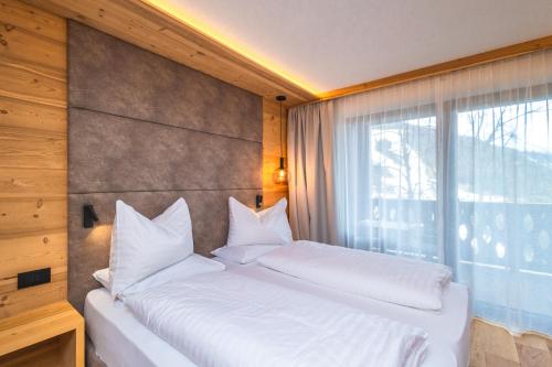 Katil atau katil-katil dalam bilik di Garni Residence Alnö - Adults Only