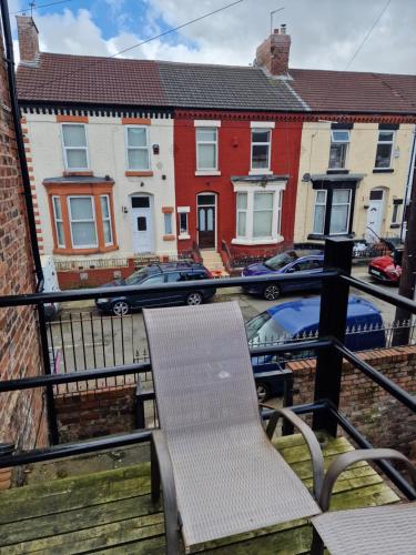 a balcony with a chair and some buildings at Spacious Double Bedroom in Liverpool