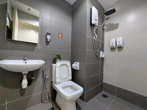 a bathroom with a toilet and a sink at 3 Elements Premium Suite-MRT2 Station-Wifi- Self Check-iN in Kampong Batu Sembilan