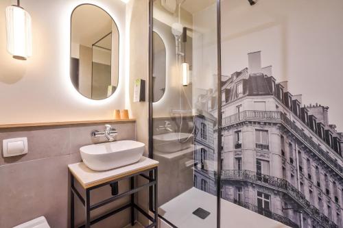 a bathroom with a sink and a shower at Campanile Paris Ouest - Pont de Suresnes in Suresnes