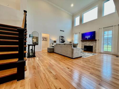 a living room with a couch and a tv at NEW, big, beautiful, Executive Home Liberty Twp in Middletown