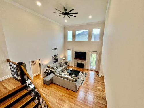 a living room with a couch and a ceiling fan at NEW, big, beautiful, Executive Home Liberty Twp in Middletown