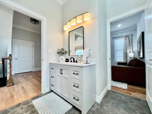 a bathroom with a sink and a mirror at Luxury Home Incredible master suite Liberty Twp OH in Middletown