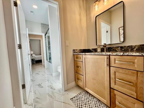 a bathroom with a sink and a mirror at Luxury Home Incredible master suite Liberty Twp OH in Middletown
