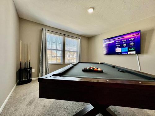 a room with a pool table and a flat screen tv at Brand new Executive home in Liberty Twp, Ohio in Maustown