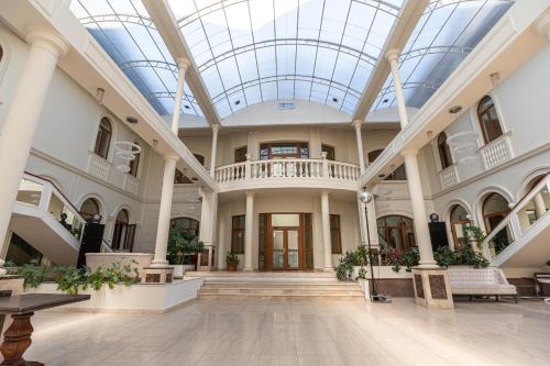 an empty lobby with a skylight in a building at Koncha Zaspa Park by HeyDay in Kozin