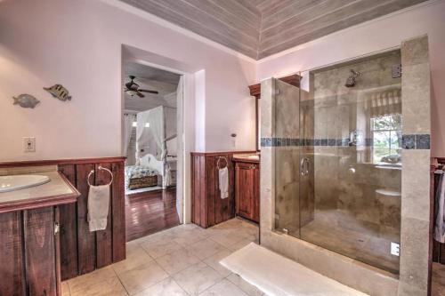 a bathroom with a shower and a sink at La Hacienda Bellevue in Bridgetown