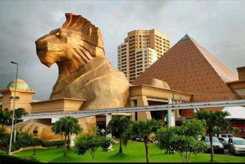 a large statue of a lion in front of a building at NEW Elegant & Cozy Greenfield Home near Sunway 2-6pax in Petaling Jaya