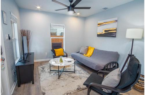 a living room with a couch and a table at Charming 3BR1BA Close to Vibrant Downtown in San Antonio