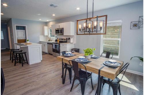 a kitchen and dining room with a table and chairs at Charming 3BR1BA Close to Vibrant Downtown in San Antonio
