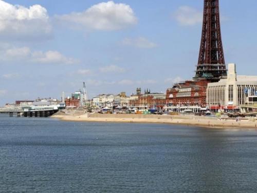 a beach with a tower in the middle of the water at South Beach Kings Promenade Hotel in Blackpool