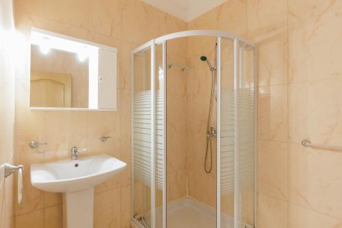 a bathroom with a shower and a sink at Villa Panorama Andrea by Villa Plus in Ágios Ilías