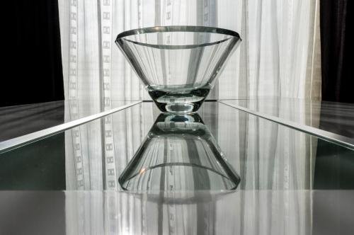 a glass vase sitting on top of a glass table at The Queen Luxury Apartments - Villa Marilyn in Luxembourg