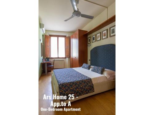 a bedroom with a bed and a ceiling fan at Ars Home - Santa Maria Novella - Ezia Home & Ars Home 25 in Florence
