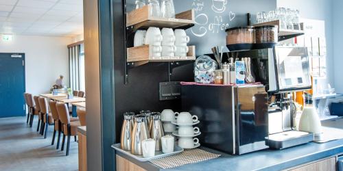 Hotel Das Augustinにあるコーヒーまたはお茶